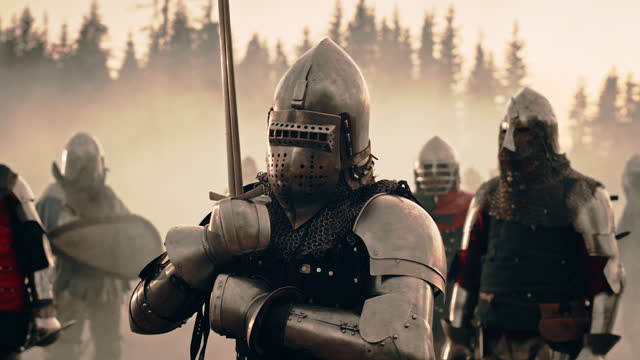 Epic Battlefield: Portrait of Knight Leader Wearing Helmet, Holding Sword, Ready for Battle. King Warrior in Dark Age Medieval War against Enemy Invasion. Cinematic Light, Historic Reenactment