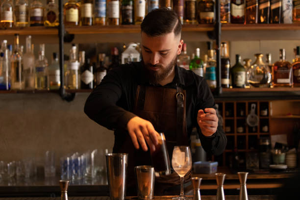 istock Young barman working at Buenos Aires' bar, Argentina 1329955408
