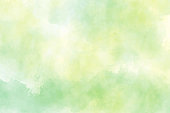 istock yellow and green watercolor background for spring 1329960632