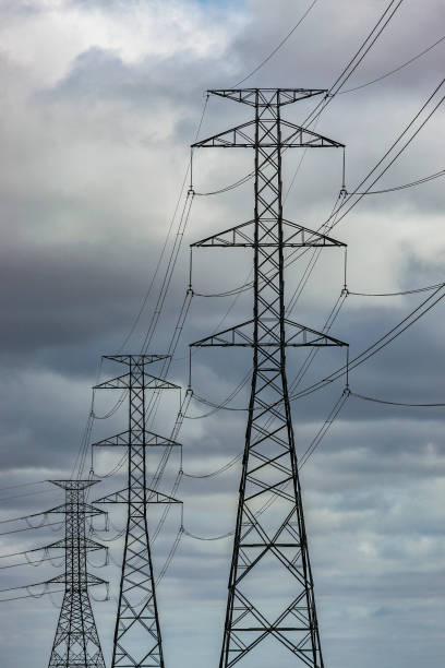 istock Dark clouds provide dramatic backdrop to high voltage power lines and pylons 1329966361