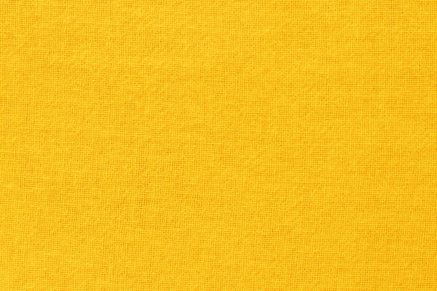 istock Yellow cotton fabric cloth texture for background, natural textile pattern. 1329966519