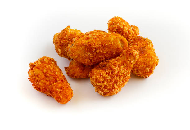 istock Heap of fried chicken isolated on white background. 1329969869