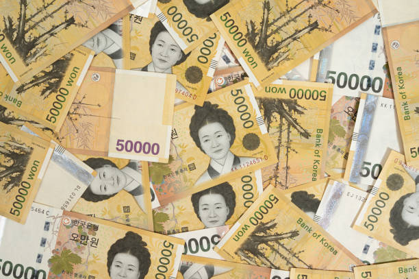Background with multiple Korean 50,000 won banknotes. stock photo