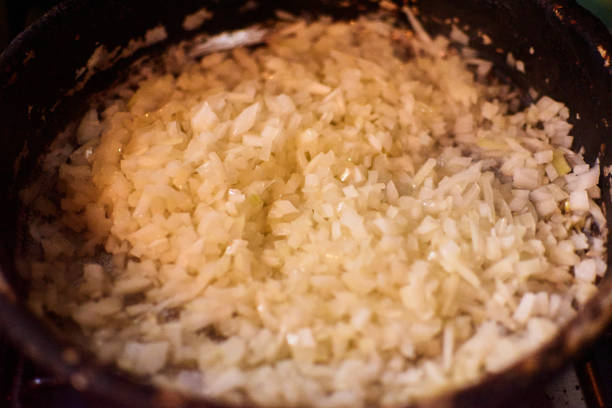 istock chopped onion frying in pan 1329972598