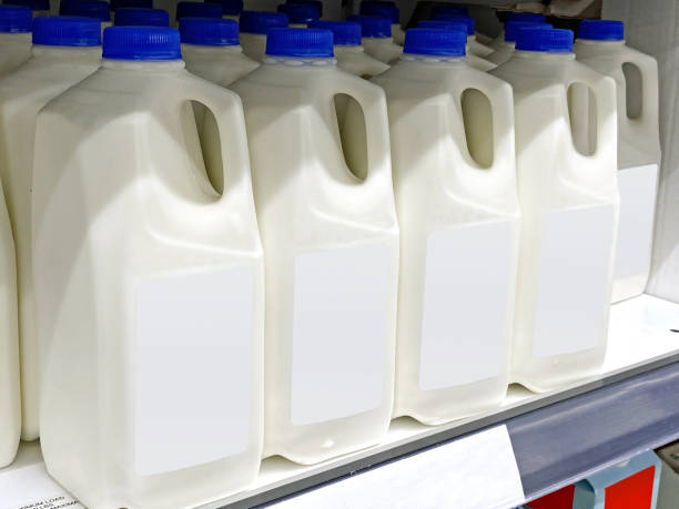 istock Milk bottles on a market display 1329976181