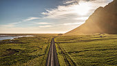 Iceland Country Road into the Sun Panorama Empty Route 1 Summer Sunset