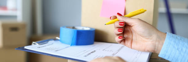 istock Woman signs documents for the delivery of parcels 1329983313