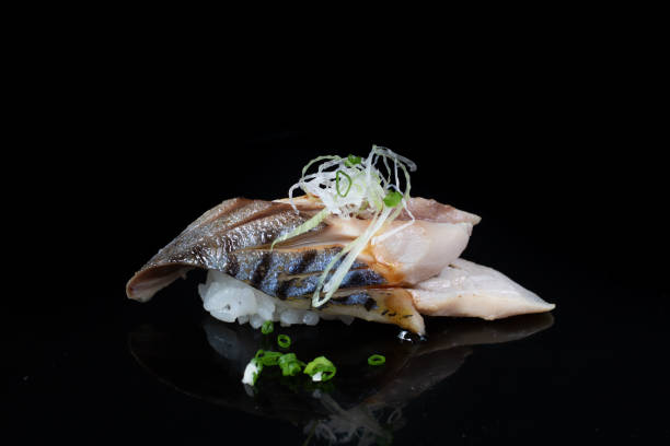 istock Shime Saba Sushi on black background. 1329984668