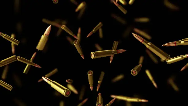 Falling bullets on a black background with depth of field. 3D rendering