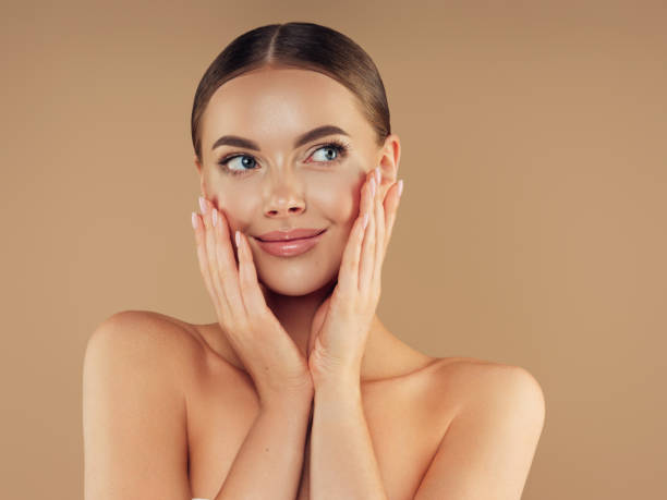 istock Young woman with clean and fresh skin 1329989353