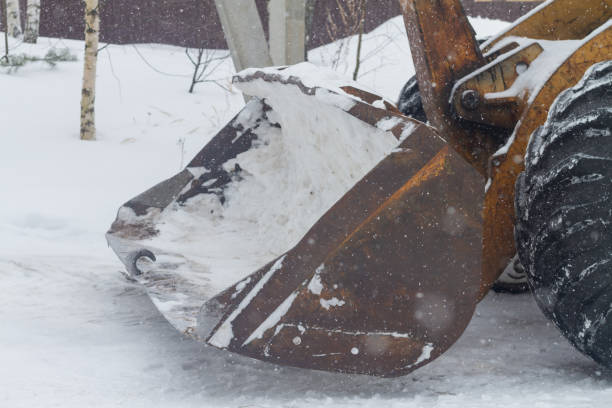 istock Excavator tractor bucket with snow in winter 1329990002
