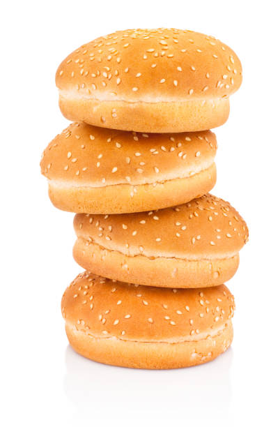 istock Four hamburger buns with sesame isolated on white background 1329991008
