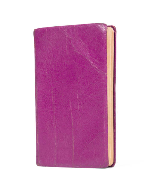 istock Small purple book, isolated on a white background 1329992231