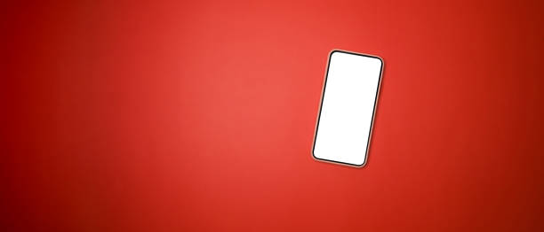 istock Mock up smart phone with blank screen on red background. 1329992262