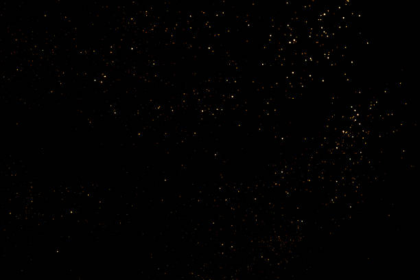 istock Golden abstract bokeh on black background. 1329993054
