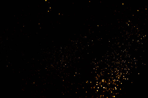 istock Golden abstract bokeh on black background. 1329993056