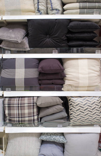istock Cool gray scale cushions and bed wear on shelves 1329993140