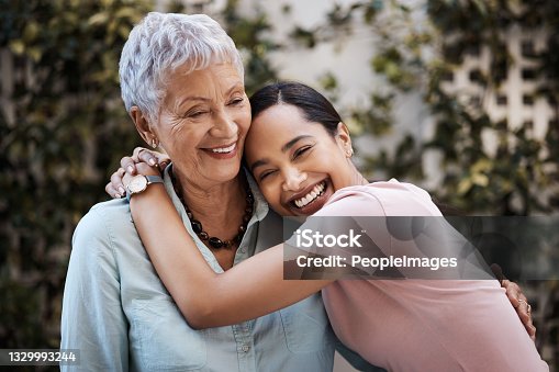 istock Shot of a senior woman spending time with her daughter in their garden at home 1329993244