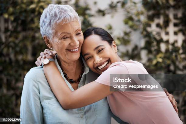 Shot Of A Senior Woman Spending Time With Her Daughter In Their Garden At Home Stock Photo - Download Image Now