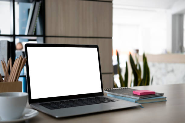 istock Close up laptop computer with white screen on office desk. 1329995250