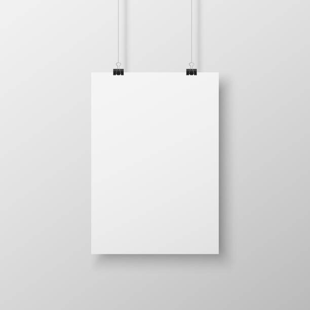 istock Realistic blank white paper hanging on office clip isolated on grey background 1329997862
