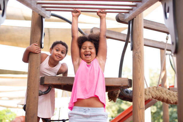 istock Children climbing on the playground. 1329997908