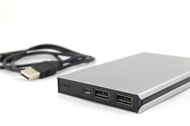 istock Power Bank Charger and USB Cable On White Background: selective focus 1329999076