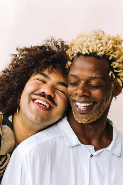 istock Romantic young gay man leaning on his lovers' shoulder 1330001237