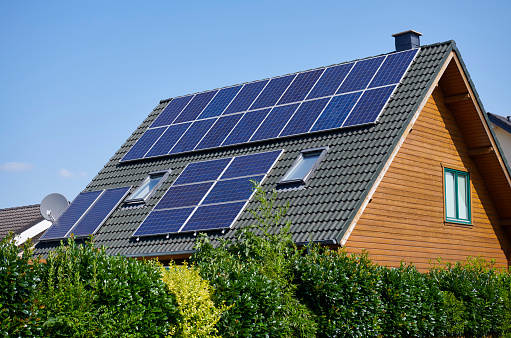 Solar panels on the roof of a single family house.