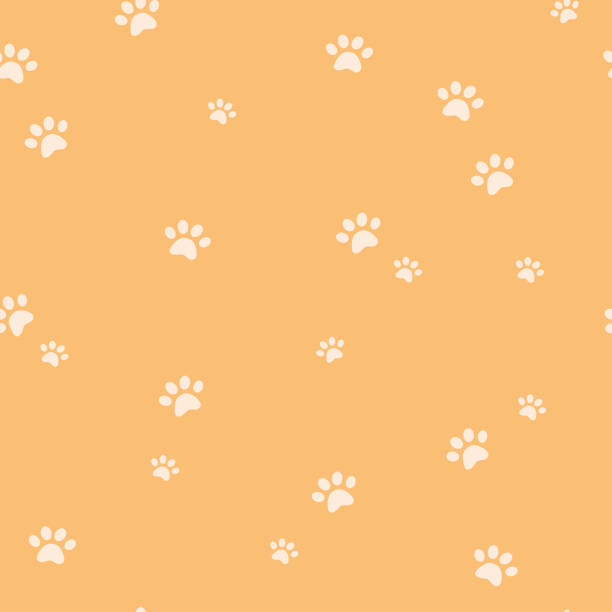 istock Dog or cat paw silhouette seamless pattern. Animal yellow repeat background 1330003802
