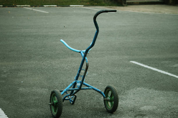 istock Golf trolley in evening golf course has sunlight shining down 1330004562