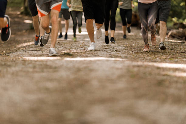 istock Group of unrecognizable athletes running through nature. 1330004614