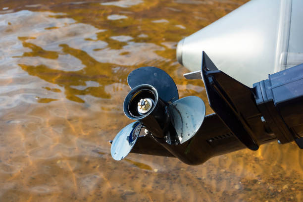 Fishing Boat Outboard Motor Propeller, Outboard Motor on a Pleasure boat, lake, river Fishing Boat Outboard Motor Propeller, Outboard Motor on a Pleasure boat, lake, river. motorboat maintenance stock pictures, royalty-free photos & images