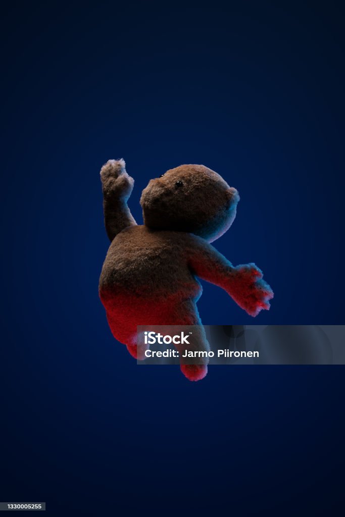 A teddy bear toy floating and reaching upwards. Bedtime Dream and Fantasy Story. A teddy bear toy floating and reaching upwards. Bedtime Dream and Fantasy Story. 3D rendering. Night Stock Photo