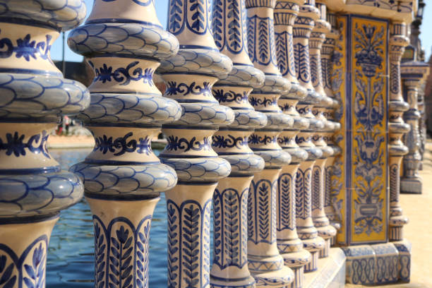 Decorative style of the art of Seville with ornate ceramic railings in blue, white and yellow colors - beautiful postcard background Decorative style of the art of Seville with ornate ceramic railings in blue, white and yellow colors - beautiful postcard background ancient creativity andalusia architecture stock pictures, royalty-free photos & images