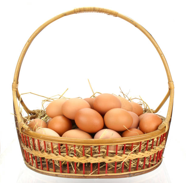 istock Brown eggs in the basket on white 1330006661