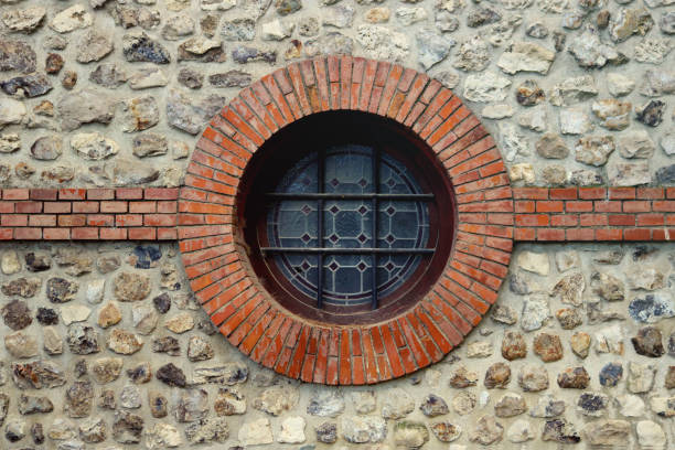 A beautiful day in Karlsruhe, Germany, the illuminating shadow tattoos itself across the rounded base of the portal.
