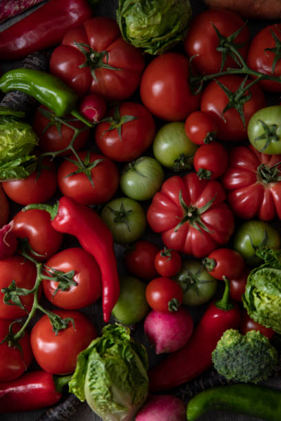 istock Green and Red Ripe Tomatoes with Vegetables 1330008481