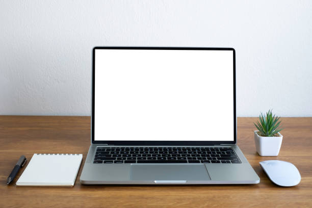 istock Front view of open laptop computer notebook with blank monitor white screen display on work table desk. Workspace office modern for job business online communication technology in shop or home indoor. 1330008600