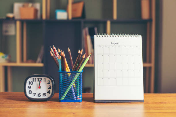 istock 2021 Calendar desk place on table. Desktop Calender for Planner to plan agenda, timetable, appointment, organization, management each date, month, and year on wooden office table.Calendar Concept. 1330010625