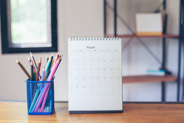 istock 2021 Calendar desk place on table. Desktop Calender for Planner to plan agenda, timetable, appointment, organization, management each date, month, and year on wooden office table.Calendar Concept. 1330010680