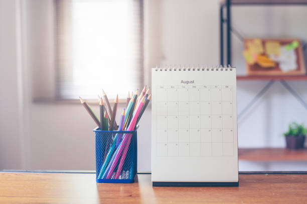 istock 2021 Calendar desk place on table. Desktop Calender for Planner to plan agenda, timetable, appointment, organization, management each date, month, and year on wooden office table.Calendar Concept. 1330010741