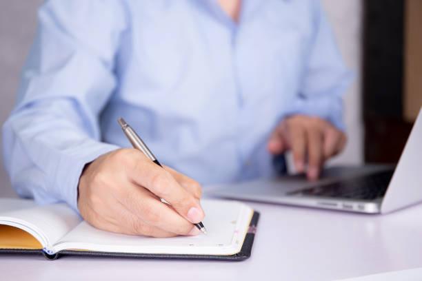 istock Hand of man watching webinar on laptop computer and writing on notebook for learning, education with e-learning online, video conference and training, seminar course, knowledge and study with digital. 1330010799