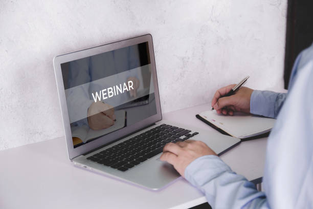 istock Hand of man watching webinar on laptop computer and writing on notebook for learning, education with e-learning online, video conference and training, seminar course, knowledge and study with digital. 1330010827