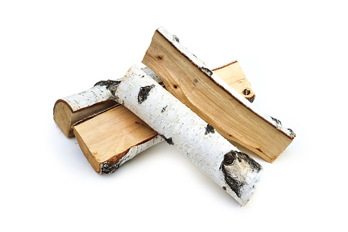 Firewood isolated on white background with clipping path. Wooden birch logs, bonfire. Close-up, front view