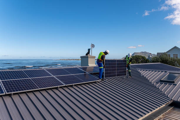istock African technicians install solar panels on a residential building 1330011106