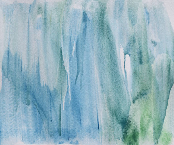 istock Color gradient from blue to green on white surface 1330013187