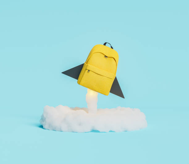 rocket school backpack yellow backpack in the shape of rocket taking off with illuminated ignition cloud. concept of education and back to school. 3d render back to school stock pictures, royalty-free photos & images