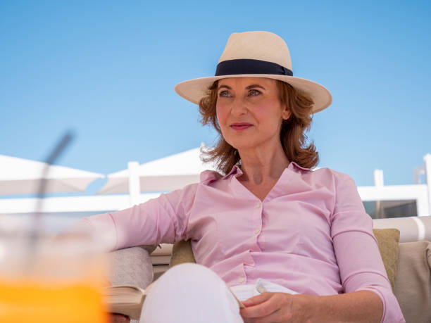 istock Woman relaxing at the beach 1330014834