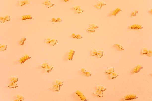 istock Variation of Pasta on Pink Background 1330017356